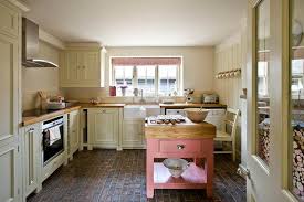 I love a light yet warm cream paint color which can be difficult to achieve. Pink Kitchen Island With Butcher Block Top Cottage Kitchen