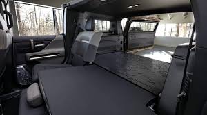The intersecting rectangular shapes and horizontal dash echo some exterior styling elements and, at least from the supplied images, the combination of black and white upholstery with bronze. Gmc Offers More 2024 Hummer Ev Suv Details Photos The Automobile Blog