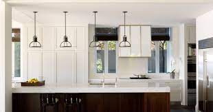 Counters of redeemed mahogany leading yearn cabinets in the kitchen of a country house in oxfordshire. How To Choose The Right Lighting For Your Kitchen