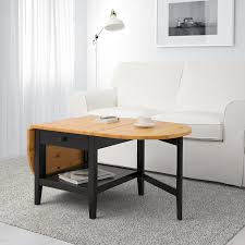 The wood is solid wood and when the light catches it it looks stunning. Arkelstorp Coffee Table Black 65x140x52 Cm Ikea