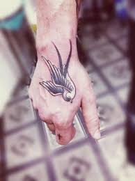 Swallow Bird Tattoo On Hand Meaning 100 Lovely Swallow Tattoos Cuded Hand Tattoos Tattoos Swallow Tattoo
