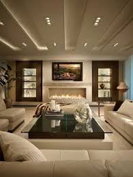 This is an example of a contemporary open plan living room in edinburgh with white walls, light hardwood flooring, a standard fireplace, beige floors, a vaulted ceiling and wainscoting. Beautiful Tv Lounge Ceiling Designs Home Architec Ideas