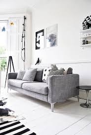 I Believe This Is An Ikea Karlstad Sofa With The Legs Swapped Out Looks Way More Expensive Without Those Awful P Living Room Grey Home Living Room Interior