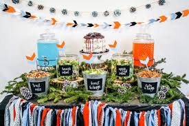 Make a blue themed diaper cake and decorate it with various baby products and place a cute blue puppy soft toy on top. 20 Festive Fall Baby Shower Ideas The Postpartum Party