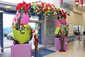We can show you some christmas door decorations ideas which makes your front door welcoming and beauty in this coming holiday season. Christmas Decorations At Car Dealership Christmas Window Decoration Christmas Decorations Showroom Decor