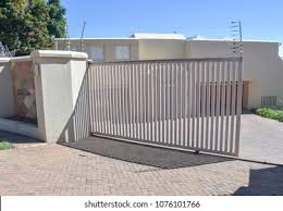 Find electric fence gate from a vast selection of fencing. Typical Electric Fence Gate Upscale Residential Stock Photo Edit Now 1076101766