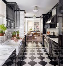 Black Galley Kitchen With Marble Tops And Wood Floor Painted To Look Like Checkerboard Tiles In A Renovated 1910s In 2020 Architectural Digest Cheap Home Decor Kitchen