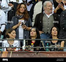 Katrin (L-R), girlfriend of Manuel Neuer, Sherin Senler, girlfriend of  Jerome Boateng and Anna Maria Lagerblom, girlfriend of Mesut Oezil on the  stand prior to the 2010 FIFA World Cup semi-final match