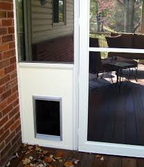 Your screen door is not a particularly strong place to mount anything and it won't stand up to a large dog going through a door mounted in it for any length of time. Screen Room Dog Door Traditional Porch St Louis By Heartlands Building Company Houzz