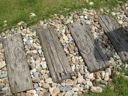 These Stepping Stones Look Like Old Wood But Are Concrete Garden Stepping Stones Garden Steps Stepping Stones Diy