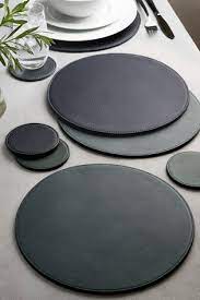 Find your designer placemats and luxury table mats here. Buy 4 Pack Teal Round Reversible Faux Leather Placemats And Coaster Set From Next United Arab Emirates