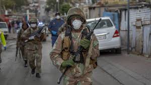 Kenyan police hold back ferry passengers causing a crowd to form outside the ferry in mombasa, kenya on friday, march 27, 2020. In Africa Fierce Enforcement Of Coronavirus Lockdowns Is Stirring Resentment Wsj
