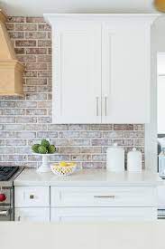 Countryside kitchen with pitched ceiling and brick backsplash. Red Brick Kitchen Backsplash Transitional Kitchen