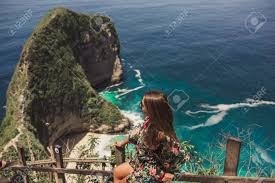 Trendy magazine & news about traveling the world, working remotely, inspiring people, and living a dream life! Pretty Girl Is Traveling On Kelingking Bay The Island Of Nusa Penida Indonesia Stock Photo Picture And Royalty Free Image Image 140229663
