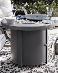 The savanna stone oriflamme fire table is a wonderful addition to an already impressive line of fire tables. Donnalee Bay Outdoor Fire Pit Table Ashley Furniture Homestore