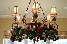 45 Christmas Decorating Ideas For Pendant Lights And Chandeliers Family Holiday Net Gui Christmas Chandelier Decor Christmas Chandelier Christmas Decorations