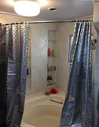 It attaches to the wall at the tub's head and hangs. Bronze Ex Cell Curved Shower Curtain Rod Shower Curtain Rods Bath Ekbotefurniture Com