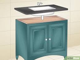 The vanity's main purpose is to house your sink, bathroom supplies, cosmetics, towels, and a million other things we all have at the ready in our home bathrooms. How To Build A Vanity Cabinet Wikihow