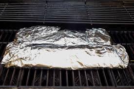 Place it under the cooking grate, close to the flames. How To Cook Pork Ribs On A Gas Grill The Traveling Spice
