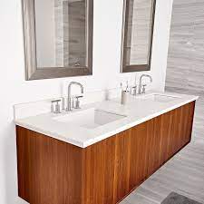 The piping is hidden inside the walls, so only the faucet spouts and taps are exposed. How To Install A Wall Mount Vanity And Sinks This Old House