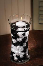 Black And White Centerpieces For Parties Black And White Faux Pearls In The Vases With Floating Candles Pretty But Probably Not A Money Saver Candles Crafts Floating Candles Diy Floating Candles