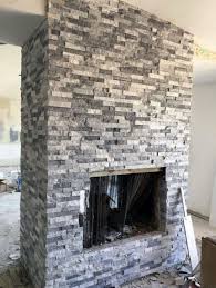 This simple fireplace shows how stacked stone in warm hues can create an outstanding look within a smallish budget. Top 60 Best Stacked Stone Fireplace Ideas Interior Designs