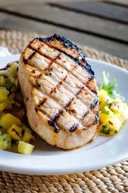 Brining pork chops, even for a short time, provides a little wiggle room on doneness. Grilled Pork Chops And Pineapple Salsa Cook Eat Well