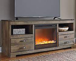 Gas fireplaces are available in many shapes and sizes. Trinell 63 Tv Stand With Electric Fireplace Ashley Furniture Homestore
