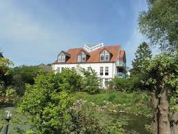 2/20 • das haus am teich über den teich hinweg betrachtet. Haus Am Teich Whg D16 In Boltenhagen Objekt We 148315
