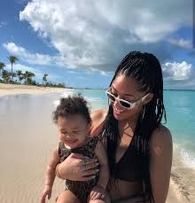 a imagem pode conter 1 pessoa nuvem oceano ceu e atividades ao ar livre jordyn woods style mom daughter outfits north and penelope