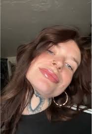 Mom with Brown Curly Hair and Tattoos Named Allison Bee