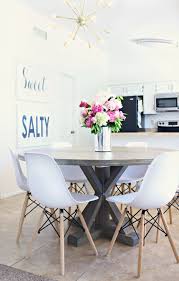 Spread out the stain as you work, so that you get a evenly covered surface. How To Stain A Wood Table A Dining Room Update Classy Clutter