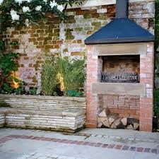 Rustic Brick Wall And Fireplace Would Love This In My Back Yard Small Courtyard Gardens Brick Wall Gardens Small Courtyards