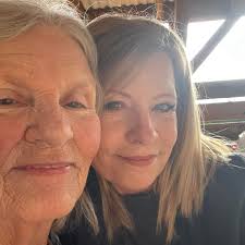 What does it mean when a prayer plant blooms and should it be repotted?