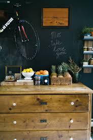 a chalkboard wall and a dresser in the