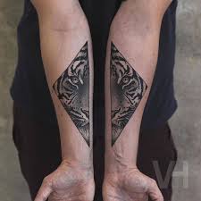 Split Animals Faces Tattoos Inked On Separate Sides Fubiz Media