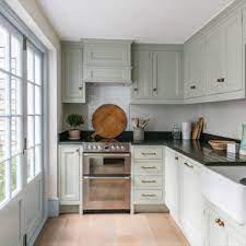 The use of butternut wood, copper, hickory, and antiqued bronze give the room warmth, while a rich blue beadboard backsplash delivers a shot of color. Small Traditional Kitchen Photos Houzz