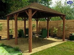 Covered patio ideas | light wooden solid patio cover design with a roof window. African Gazebo Design Inspiration Designing An Aesthetic Interior