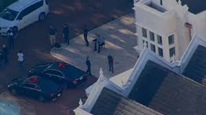FBI raids Tampa mansion, arresting two on conspiracy charges