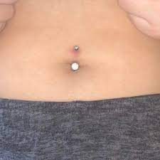 Is It Normal For My Navel Piercing To Be Red And With A Little Bit Of Crust Around The Hole Or Is This Possible Sign Of Infection I Got It About 5