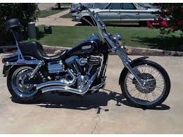 Extended forks, bolt on rake kits and raked triple trees. Dyna Wide Glide Old Style Harley Davidson Harley Harley Davidson Chopper