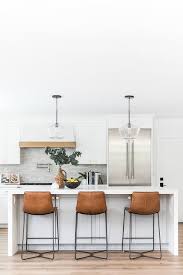 White counter & bar stools : Three Brown Leather Stools At White Waterfall Island Transitional Kitchen