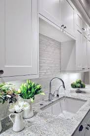 The lovely feature anchors the contrasting dark and light cabinetry. Top 60 Best Kitchen Stone Backsplash Ideas Interior Designs