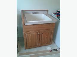 oak finish utility sink/laundry tub