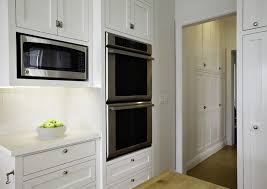 White Kitchen With Built In Cabinetry For Microwave Or Oven Decorioo Buying Kitchen Appliances Double Oven Kitchen Kitchen Design