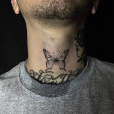 Black Butterfly Tattoo On The Front Of The Neck Black Butterfly Tattoo Butterfly Neck Tattoo Neck Tattoo For Guys