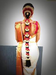 You can make these wedding hair styles for your medium and long hair by yourself at home. South Indian Bridal Hairstyle With Flowers For Wedding Glamour