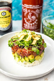 This ahi poke bowl is made with ahi tuna, a tamari soy sauce marinade and sushi rice, then topped with cucumber, avocado, microgreens and sprinkled poke bowl is one of my favorite meals to grab at a restaurant, but it's so easy to make at home! Ahi Tuna Sushi Stacks Cactus Club Copycat Tuna Sushi Tuna Stack Recipe Tuna Poke Bowl