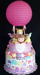 Focuses on unique baby shower cake ideas and designs while touching on the merits of decorating your own cake. Hot Air Balloon Diaper Cake Www Facebook Com Diapercakesbydiana Baby Diaper Cake Baby Shower Diaper Cake Creative Baby Shower