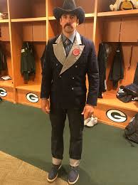 This is an aaron rodgers mustache and headphones graphic. Aaron Rodgers Parties In Denim Outfit After Getting Huge Contract People Com